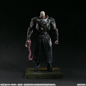 Detail view of the Nemesis figure featuring the interchangeable tentacle arm part extended downward.
