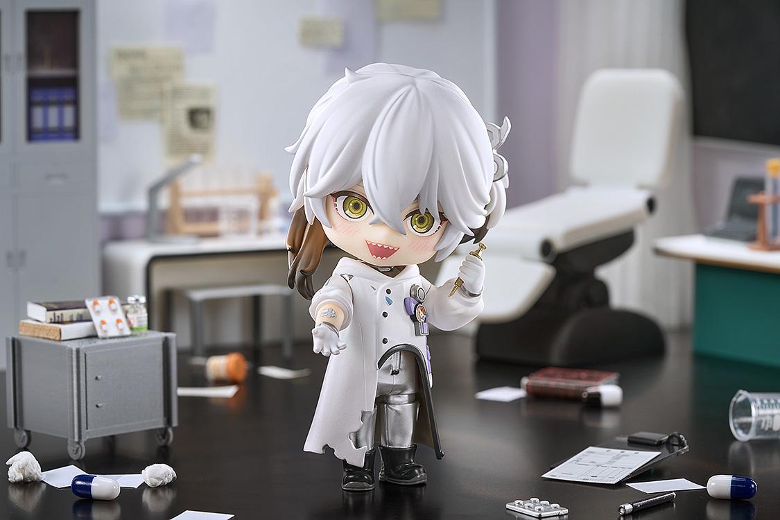 Wide diorama shot of the Medicine Pocket Nendoroid figure reaching a hand out with a wide laugh, surrounded by miniature lab equipment and medical clutter.
