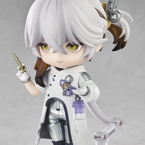 Medicine Pocket Nendoroid figure showing a displeased, serious face plate while holding a small gold syringe accessory.