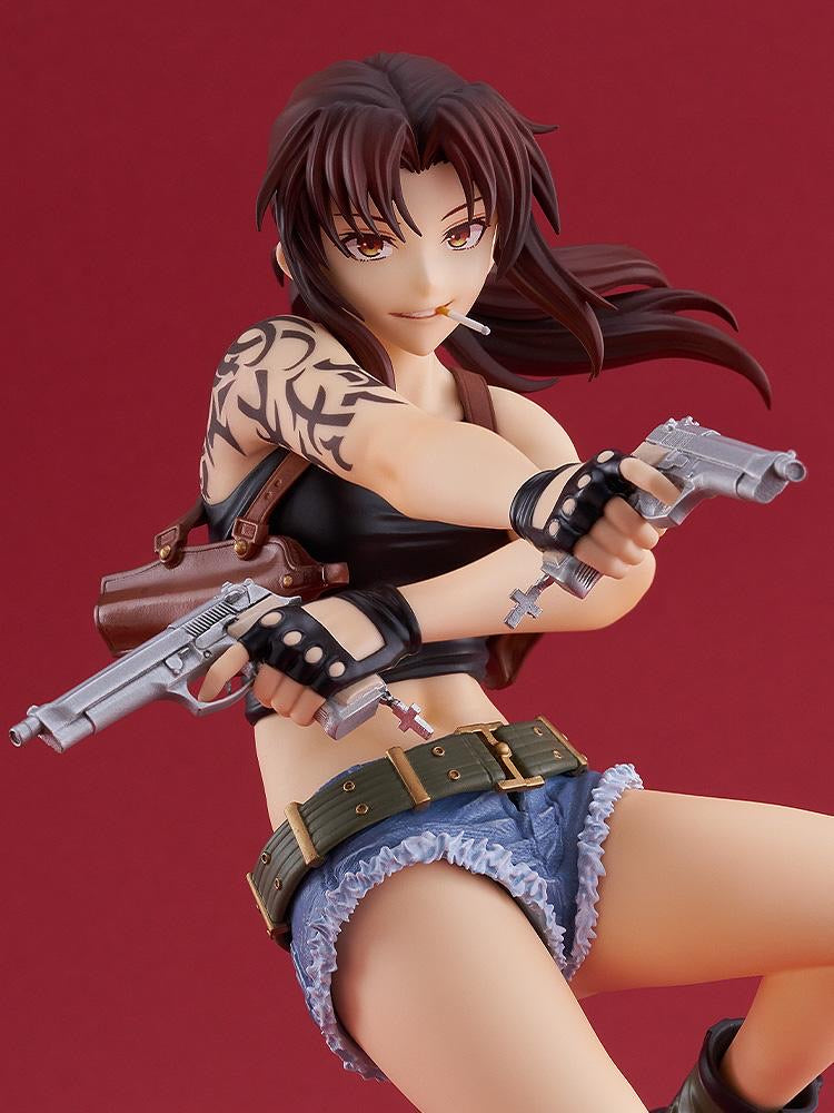Detailed close-up shot of the Revy figure against a solid red background, focusing on her mischievous grin and reckless confidence.