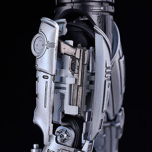 Close-up of the right thigh assembly showing the functional holster parts and ejected Auto 9 state.