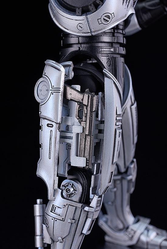 Close-up of the RoboCop Moderoid's right thigh showing the deployed holster part with the Auto 9 stored inside.
