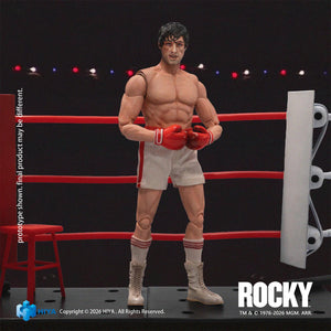 Front view of Hiya Toys Rocky Balboa 1/12 action figure with battered face sculpt wearing white boxing shorts and red gloves.
