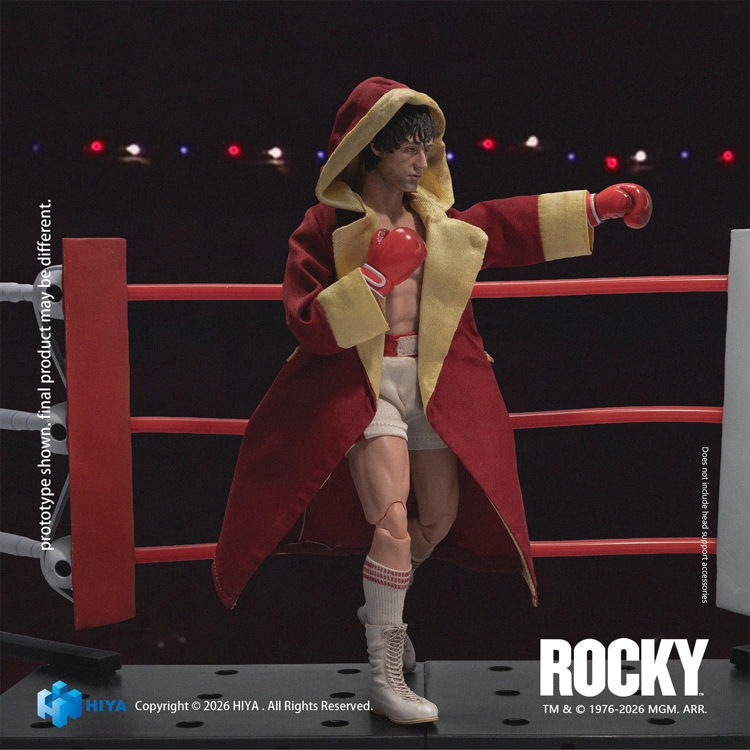 Hiya Toys Exquisite Super Series 1/12 scale Rocky Balboa action figure wearing a red hooded entrance robe in a boxing ring pose.