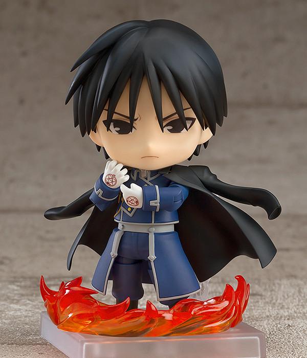 Roy Mustang Nendoroid with a serious expression and sharp eyes, standing behind a circle of translucent fire effect parts on the ground.
