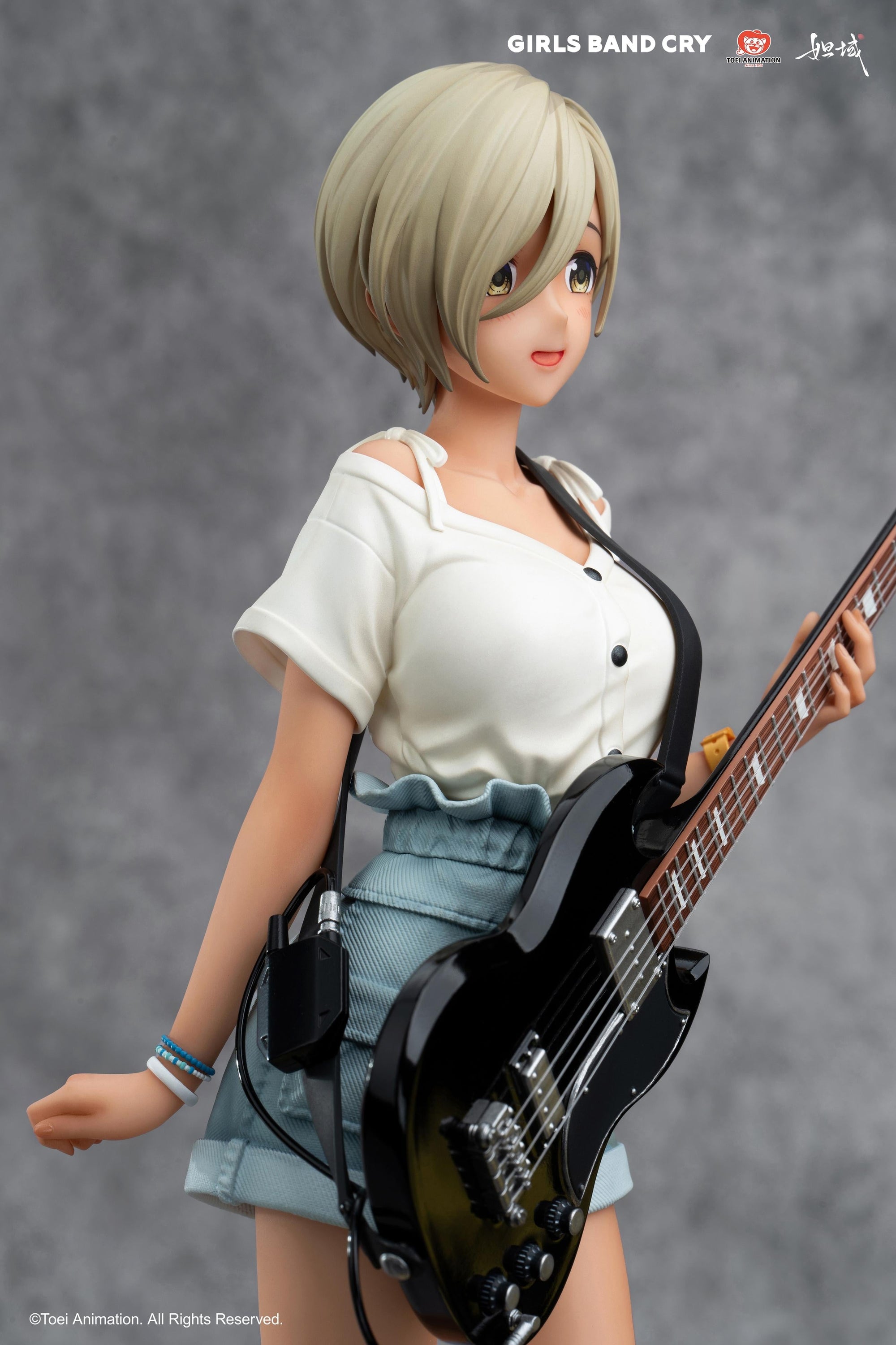 Close-up of the upper body of Rupa figure highlighting the fabric textures of her stylish casual outfit.