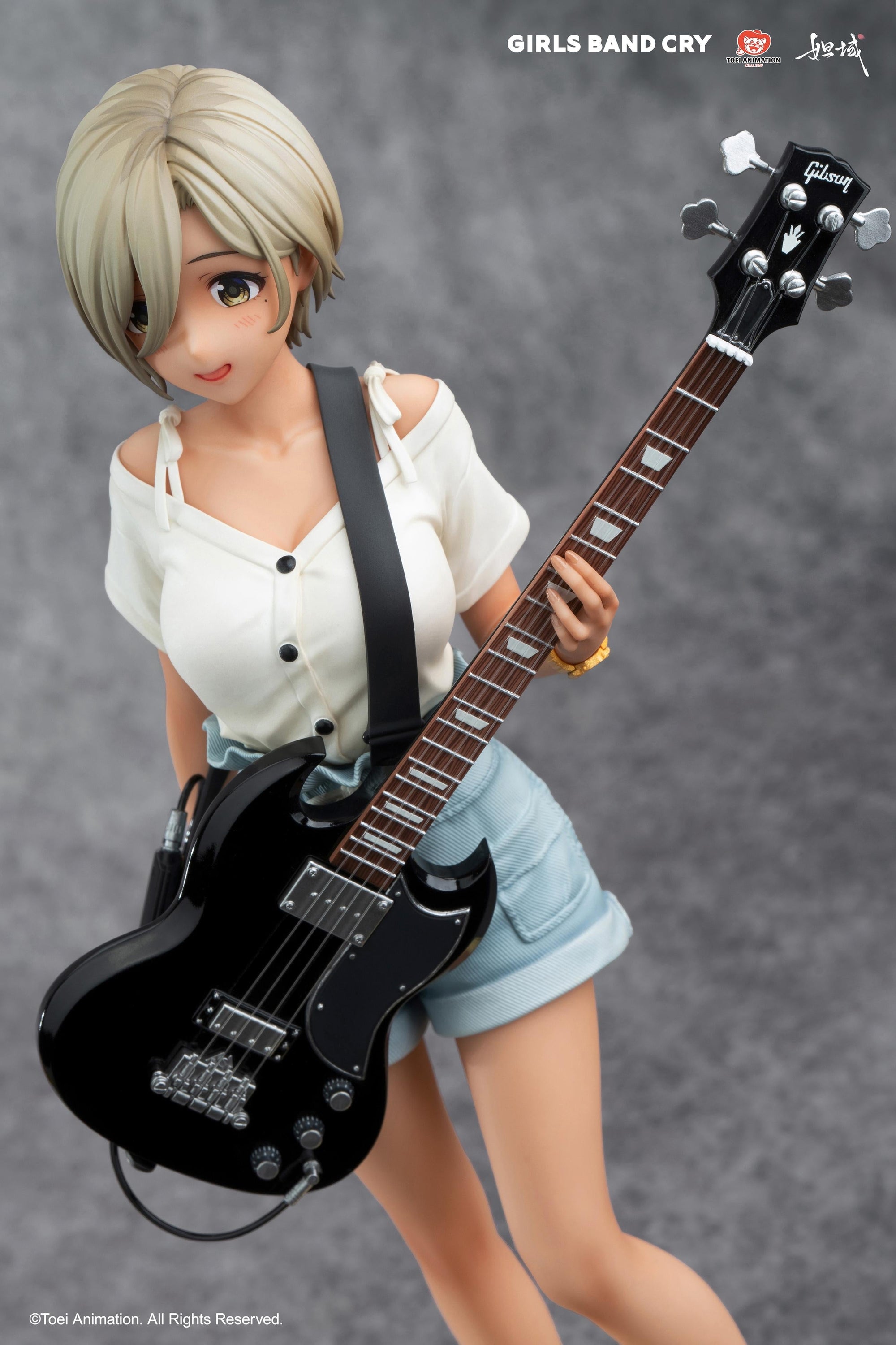 High-angle close-up of Rupa from Girls Band Cry focusing on the black bass guitar and instrument cable detail.