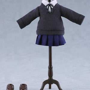The fabric dark grey school uniform sweater, navy pleated skirt, loop tie ribbon, and brown magnetic loafers of the Ryo Yamada Nendoroid Doll displayed on a miniature black clothing mannequin stand.