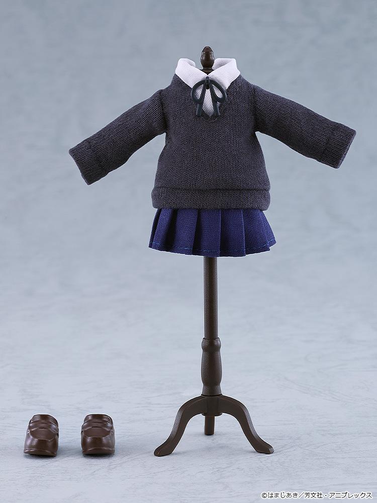 The fabric dark grey school uniform sweater, navy pleated skirt, loop tie ribbon, and brown magnetic loafers of the Ryo Yamada Nendoroid Doll displayed on a miniature black clothing mannequin stand.
