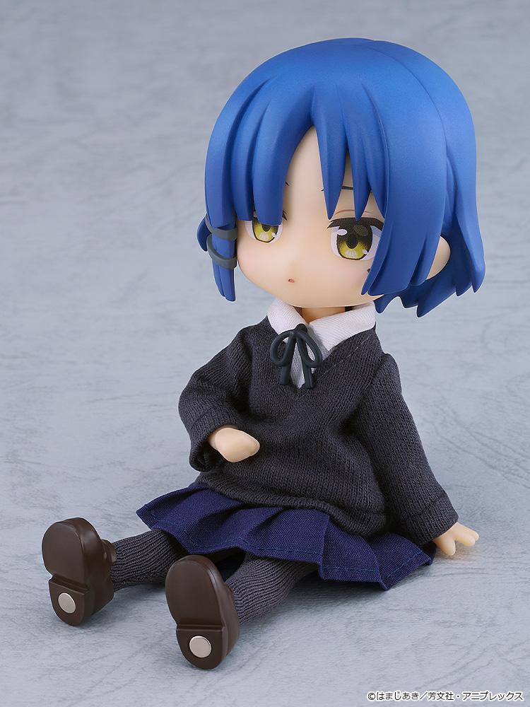 Casual sitting pose of the highly articulated Ryo Yamada Nendoroid Doll figure relaxed on the floor with a calm, neutral expression.