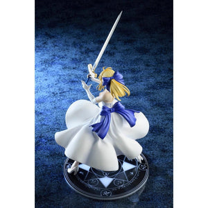 A three-quarter view of the Saber/Altria Pendragon figure from the left, highlighting her flowing dress, Excalibur, and the magical symbol on the base.