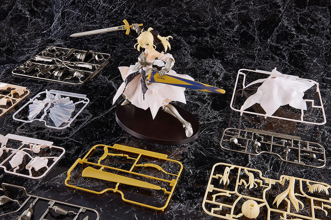 The assembled Saber Lily model kit displayed alongside its unassembled plastic runners and parts included in the box.