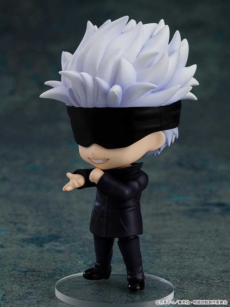 Dynamic side angle view of Satoru Gojo Nendoroid wearing his eye mask and pointing forward on a transparent base.