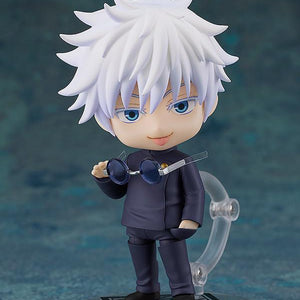 Satoru Gojo Nendoroid figure revealing his bright blue eyes as he lowers his dark round sunglasses with a smug, teasing expression.