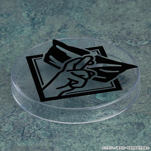 Top-down view of a clear circular Nendoroid display stand base featuring a black graphic print of Satoru Gojo's eye mask hand sign.