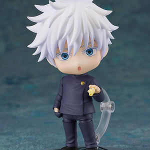 Satoru Gojo Nendoroid figure showcasing a comical surprised or sulking face plate with a small yellow Koregusu bottle accessory in his hand.
