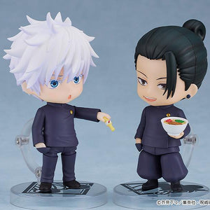 Satoru Gojo Nendoroid offering a Koregusu bottle to a smiling Suguru Geto Nendoroid holding a miniature bowl of ramen, recreating a slice-of-life anime scene.