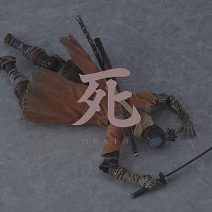 The figma Sekiro action figure in a defeated pose featuring the iconic red "DEATH" kanji effect sheet from the video game.