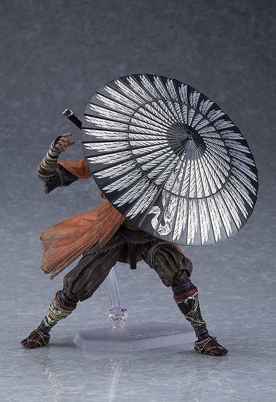 Highly articulated figma Sekiro figure in a defensive stance with the Loaded Umbrella shield prosthetic tool deployed.