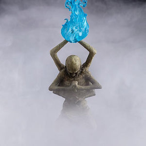 Cinematic close-up of the Sculptor's Idol accessory with a translucent blue flame effect amidst atmospheric smoke.