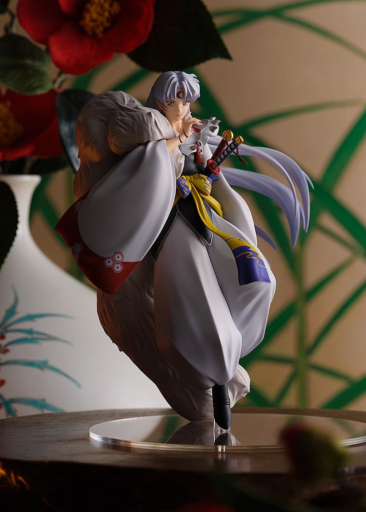 Cinematic shot of the Sesshomaru figure in a traditional Japanese room setting with floral accents and warm lighting.