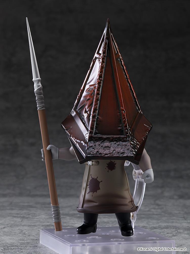 Front studio view of the Silent Hill 2 Red Pyramid Thing Nendoroid holding a long spear accessory vertically.