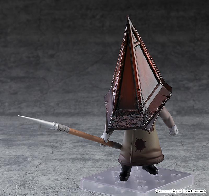 Side action pose of the Red Pyramid Thing Nendoroid figure wielding a spear horizontally on a transparent display stand.