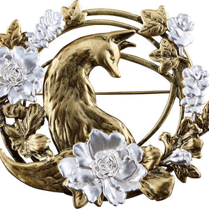 Front close-up view of the Silent Hill f brass brooch replica on a white background, featuring a sculpted fox with silver floral accents.