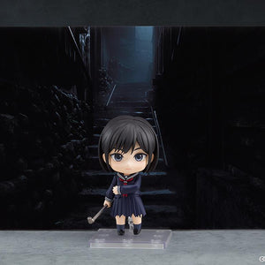 Promotional display shot of the Hinako Shimizu Nendoroid figure set against a dark, atmospheric Silent Hill f alleyway backdrop.