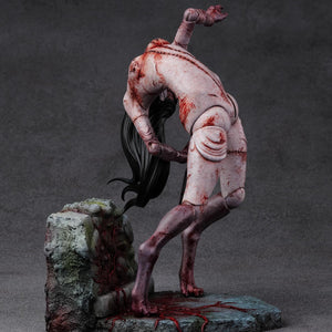 Front angled view from the left of the Kashimashi 1/6 scale figure, highlighting the creature's eerie grin and blood-stained skin.