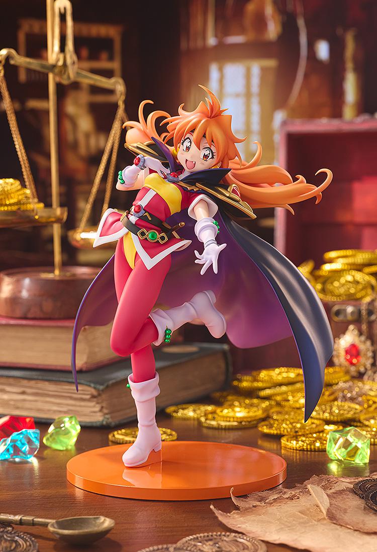 Promotional lifestyle display shot of the KDcolle Lina Inverse figure surrounded by gold coins, gems, and vintage books.