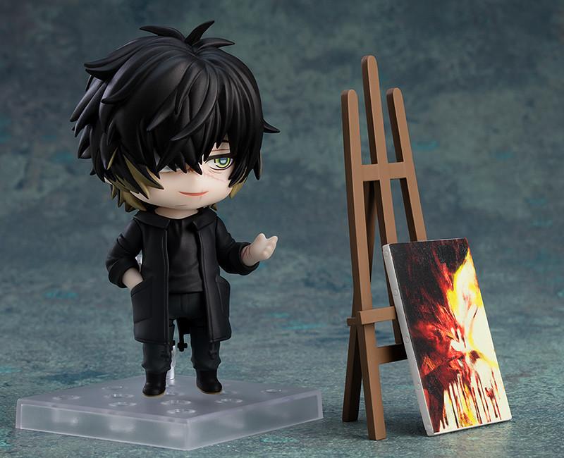 Towa Nendoroid figure gesturing beside a wooden easel and abstract painted canvas.