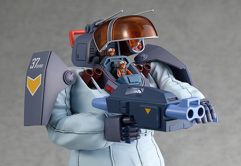 Close-up shot of the Soltic HT128 Big Foot model kit with the cockpit open to reveal two seated pilot mini-figures.