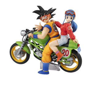 Three-quarter rear shot of the Goku and Chi-Chi collectible statue on a white background, featuring the "20" decal and "CA521" license plate.