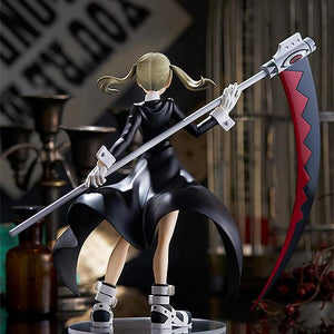 Rear view of the Maka Albarn Pop Up Parade figure showing her long black coat and pigtails.