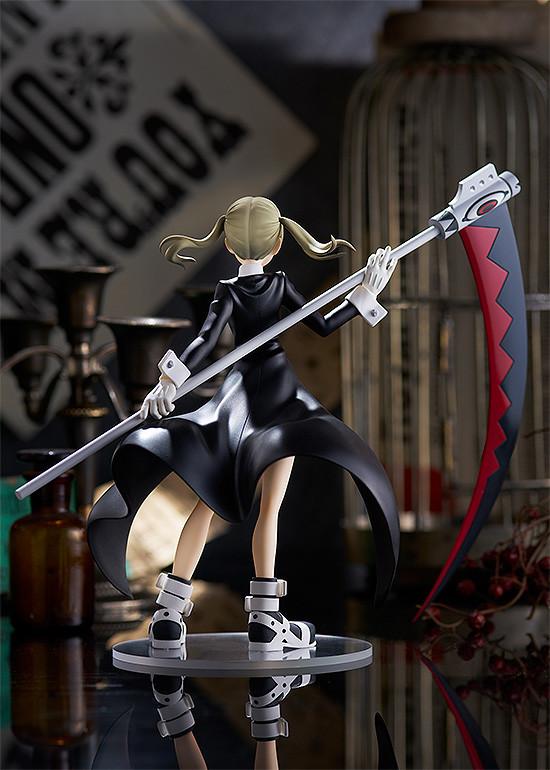 Rear view of the Maka Albarn Pop Up Parade figure showing her long black coat and pigtails.