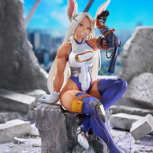 Wide promotional scene of the Mirko figure seated among city battlefield ruins under a blue sky.