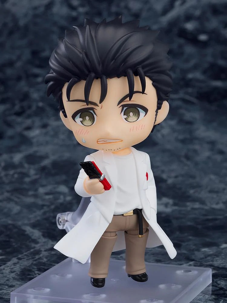 Close-up on the Nendoroid Rintaro Okabe 2.0 figure with the panicked face plate, holding the cellphone.