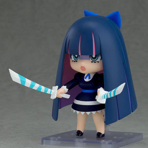 Action pose of the Stocking Nendoroid figure dual-wielding her Stripes I and II swords with a displeased, open-mouthed expression.
