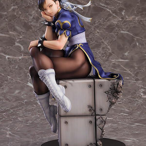 Chun-Li figure in a relaxed pose with elegant blue and gold qipao and white combat boots.