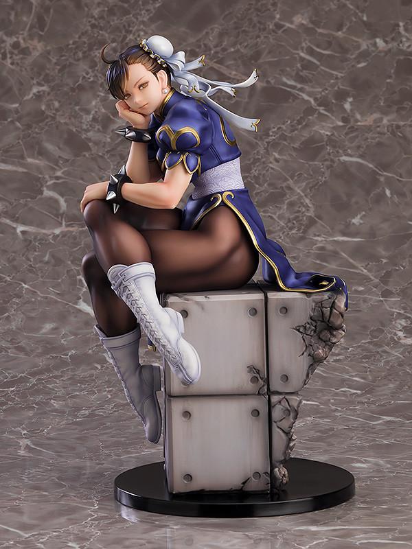 Chun-Li figure in a relaxed pose with elegant blue and gold qipao and white combat boots.