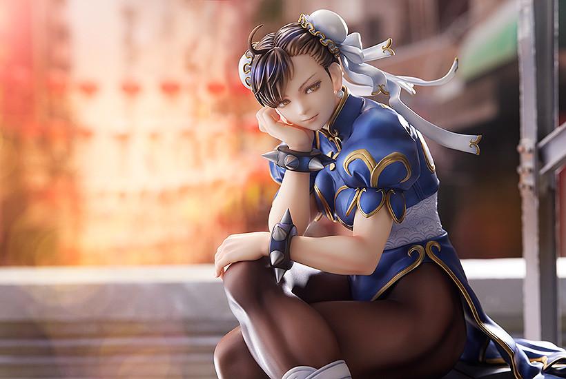 Close-up landscape view of Chun-Li's face and upper body in a blurred urban daylight environment.