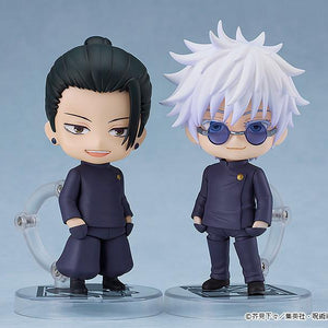 Studio display showing the Suguru Geto school uniform Nendoroid posed side-by-side with the matching Satoru Gojo Tokyo Jujutsu High School Nendoroid figure.