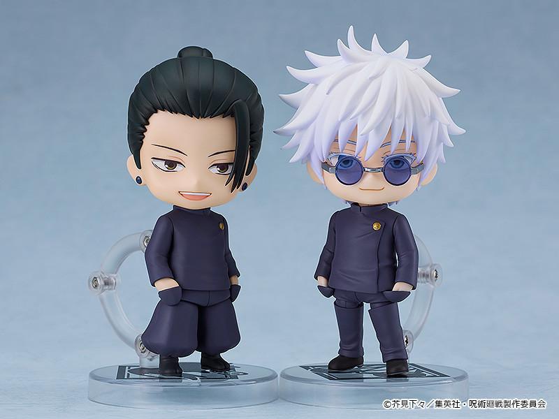 Studio display showing the Suguru Geto school uniform Nendoroid posed side-by-side with the matching Satoru Gojo Tokyo Jujutsu High School Nendoroid figure.