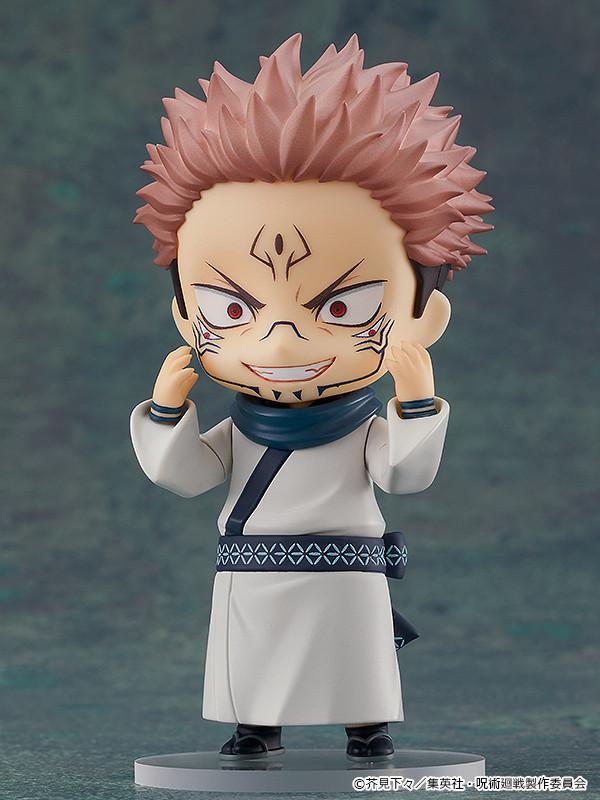 Close-up view of the Sukuna Nendoroid showcasing the crazed face plate with a wide, toothy grin and hands raised to his cheeks.