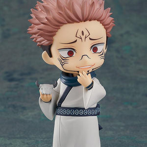 Sukuna Nendoroid collectible figure holding his white cow skull accessory in his right hand while touching his chin with a scheming smile.
