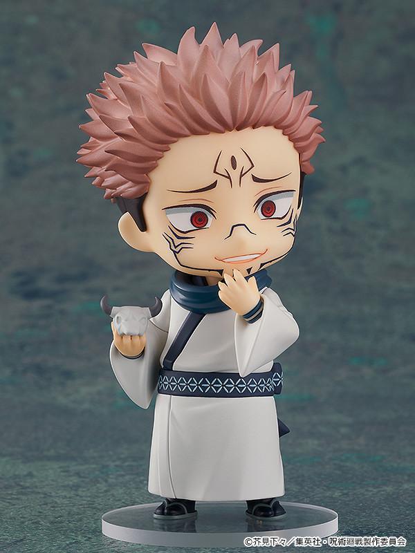 Sukuna Nendoroid collectible figure holding his white cow skull accessory in his right hand while touching his chin with a scheming smile.