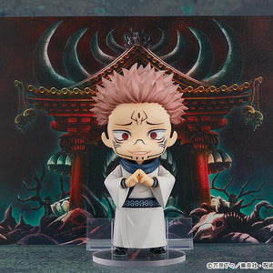 Sukuna Nendoroid figure performing his domain expansion hand sign in front of the included Malevolent Shrine backdrop illustration sheet.