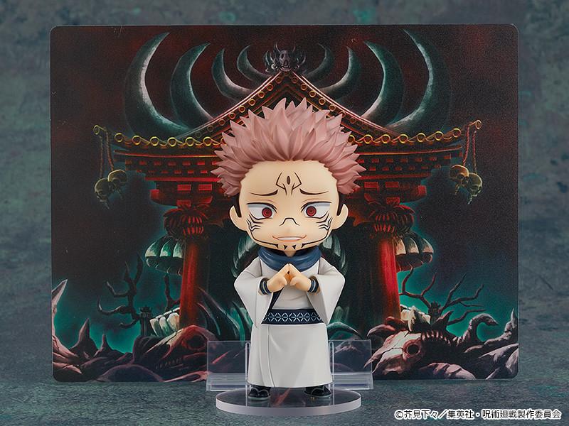 Sukuna Nendoroid figure performing his domain expansion hand sign in front of the included Malevolent Shrine backdrop illustration sheet.