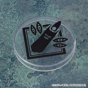 Top-down view of a clear circular Nendoroid display stand base featuring a black graphic print of Ryomen Sukuna's cursed finger and eyes.